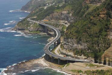 Sea Cliff Bridge on Lawrence Hargrave Dr, as seen from the air.