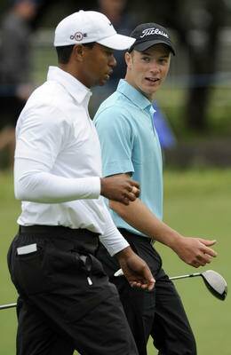 Kieran Pratt  (right) on the course with Tiger Woods, who he said was ‘‘just a normal guy’’.