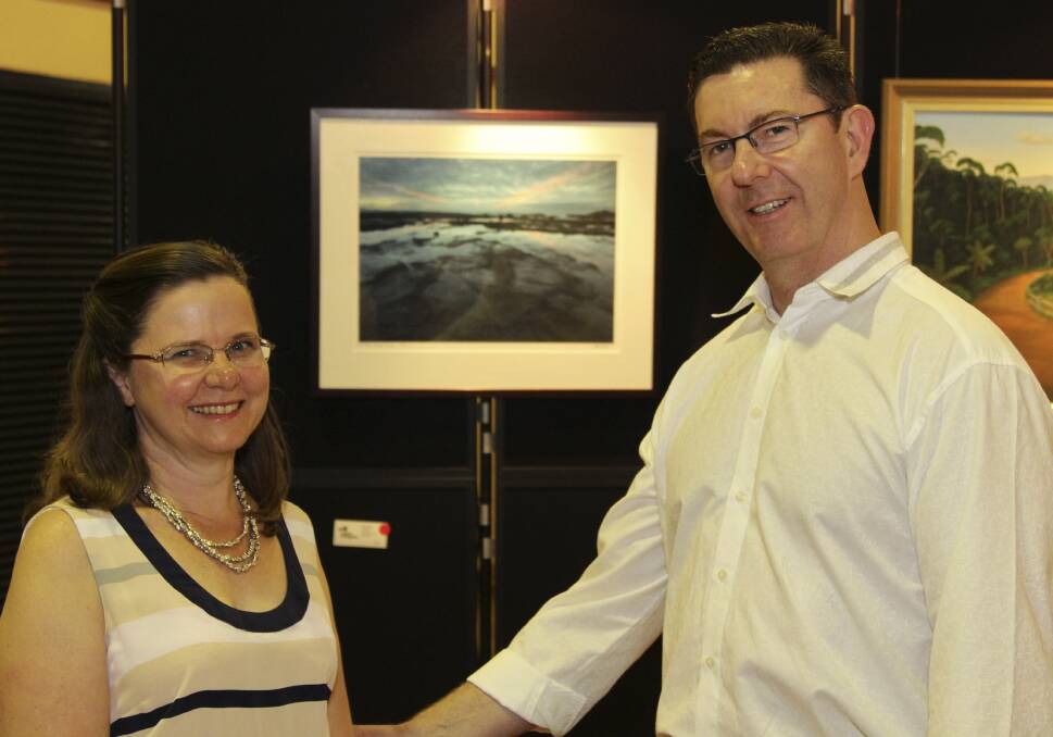  Catherine and Graham Lancaster buy art to help provide services to new refugee families.