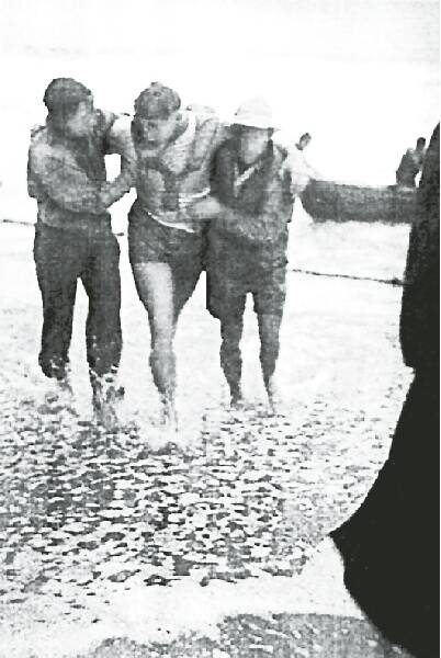 Mr Smith rescues a fellow lifesaver in the 1949 tragedy.