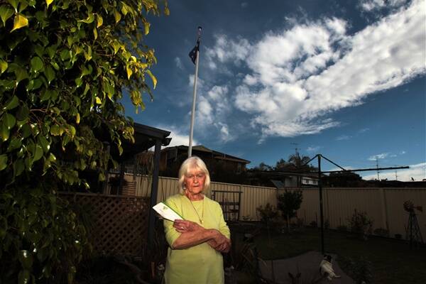 Enid Robinson from Mount Warrigal has been told to remove her flagpole or face fines of $1.1 million and $110,000 a day. Picture:  GREG TOTMAN