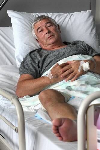 George Postlep recovering in his hospital bed. Picture: ORLANDO CHIODO