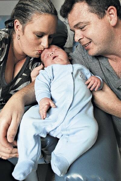 Cordell Aidan Hayman with parents Kerry Barry and Glenn Hayman. Cordell tipped the scales at 6.52kg, the size of an average four-month-old.