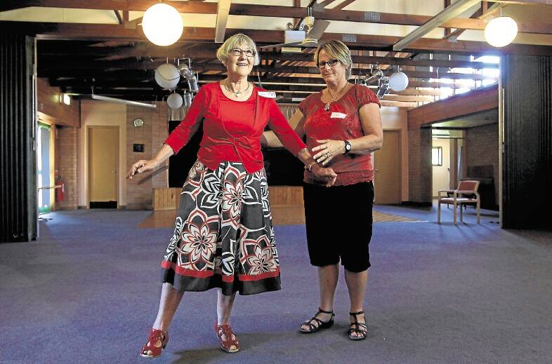 Stepping On's Gail Etheredge works through some balancing moves with Beth Robinson at the Bulli Senior Citizens Club. Picture: SYLVIA LIBER