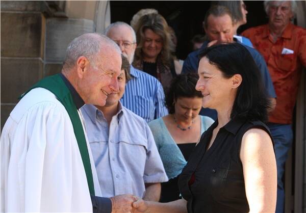 Rev Gordon Bradbery farewells parishioners after Sunday's 10am service at Wesley Uniting Church on the Mall.