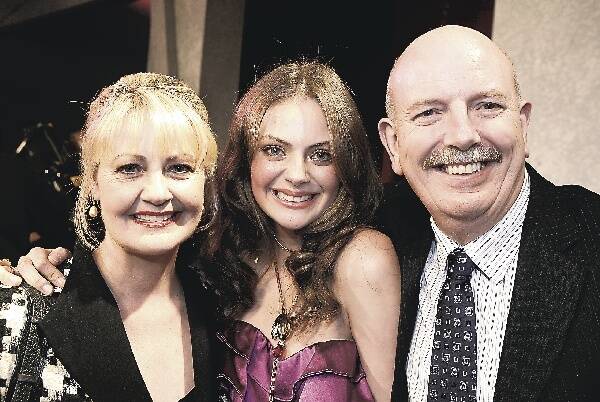 Demelza Reveley celebrates winning Australia's Top Model with her parents Margaret and Andrew Reveley. Pictures: DAVE TEASE