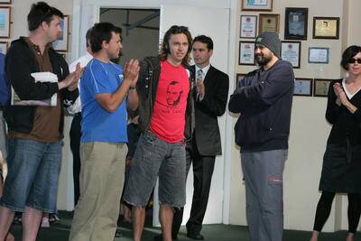 Tim Berry (in red shirt) during an auction for Tibra's current premises in 2007. Photo: ROBERT PEET