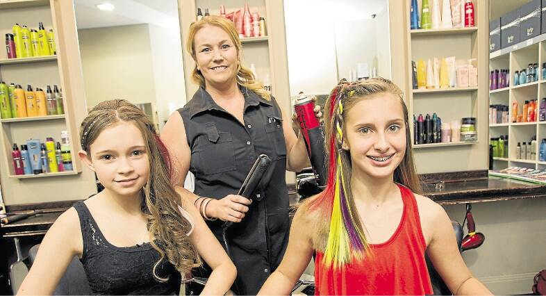 MERCURY NEWS HAIRCUT Picture shows La Mode salon owner Patrice Cook with Jess Ellis, 13 and Stephanie Paiola, 14. Photo taken on the 27th of September, 2013. Photo Christopher Chan.