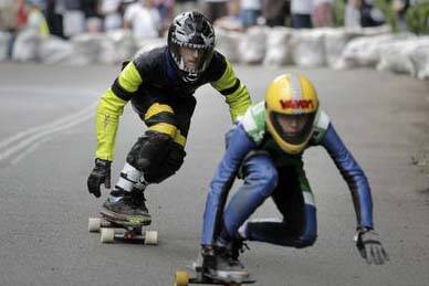 Competitors weave along the bends of Mt Keira yesterday during the Mt Keira Downhill Challenge. Picture: ANDY ZAKELI
