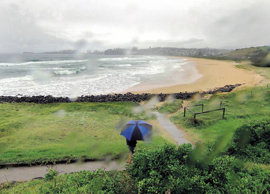 Unsafe: Bombo Beach is closed because of sewage outfall and bad weather. Sydney Water said the plants were just doing what they were meant to do. Picture: SYLVIA LIBER
