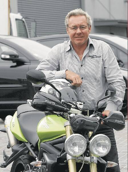 Gardner at his warehouse in Fairy Meadow. He's involved in the National Road Safety Council's efforts to reduce the national road toll. Picture: KIRK GILMOUR
