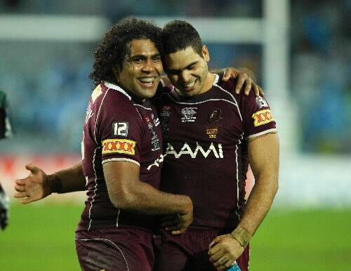 Greg Inglis with Queensland team-mate Sam Thaiday. Inglis' foster parents are believed to have advised him to choose the Maroons.