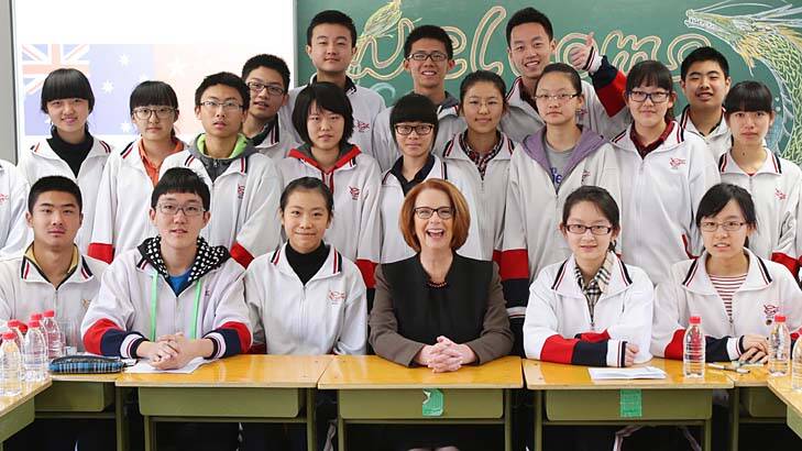 Prime Minister Julia Gillard with year 11 students at Chenjinglun High School in Beijing. Photo: Pool