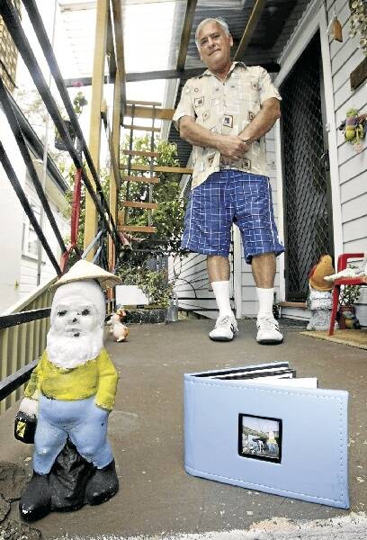 John Ranger, his gnome and the mystery photo album. Picture: KIRK GILMOUR