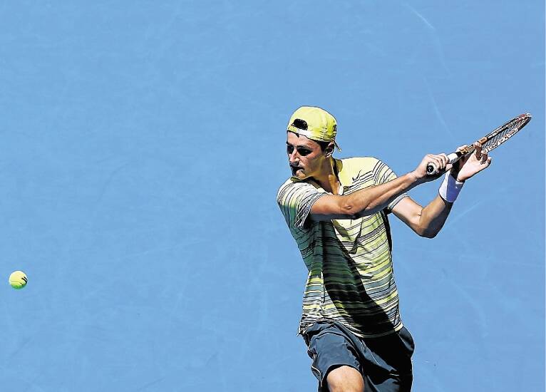 Bernard Tomic plays a backhand to Andreas Seppi at the Perth Arena. Picture: GETTY IMAGES