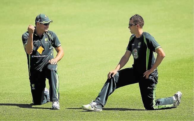 Ryan Harris and Peter Siddle warm up during an Australian nets session at the WACA in Perth. Picture: GETTY IMAGES
