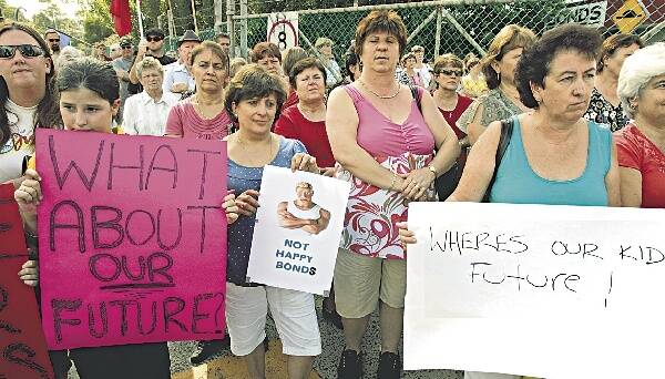 Protesters line the gates of the Bonds factory at Unanderra yesterday. Picture: ANDY ZAKELI
