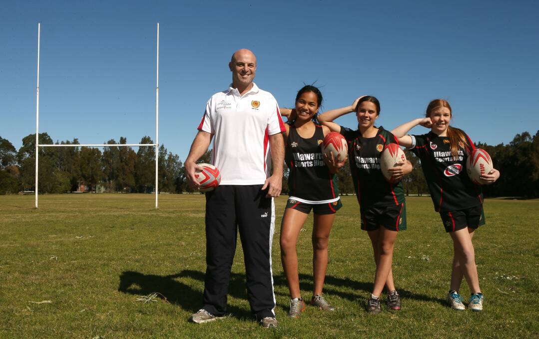 Illawarra Sports High coach Craig Wells with, left, Eleni Amone, Brodie Grodam and Chelsea Hawkins. Picture: KIRK GILMOUR