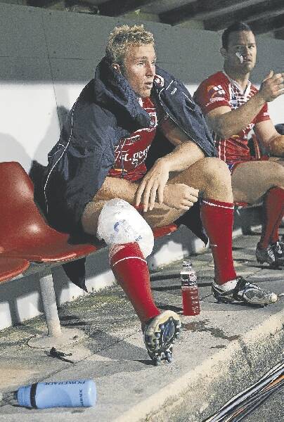 Prop Matt Prior ices his right knee on the sideline on Friday night. Picture: ANDY ZAKELI