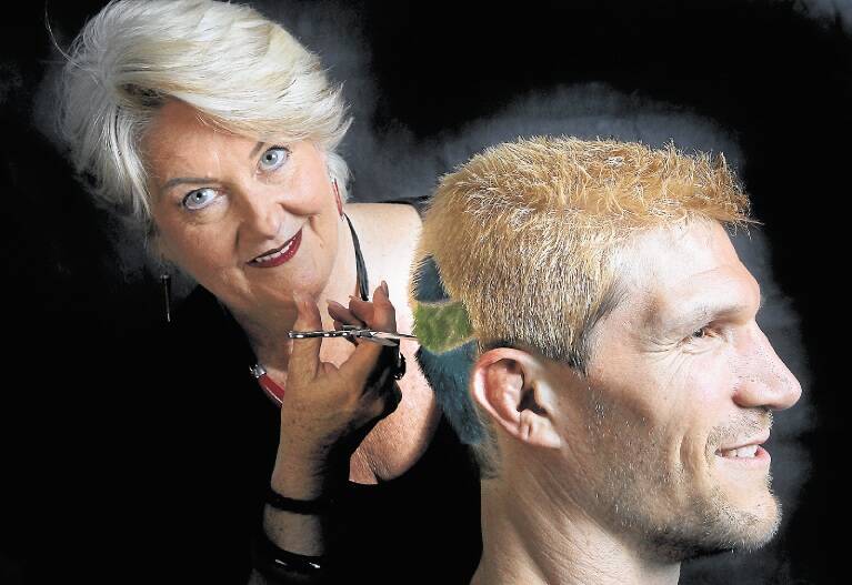 Profile: Robyn David te Velde cuts the shape of a lighthouse on the head of James Hogg to raise awareness of mental health. Picture: SYLVIA LIBER