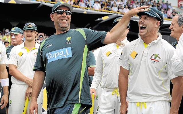 Coach Darren Lehmann and David Warner after winning back the Ashes in Perth. Picture: GETTY IMAGES