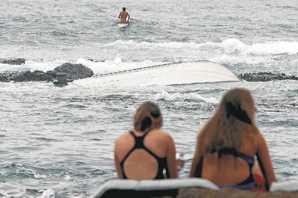 Freak wave capsizes boat off Port Kembla