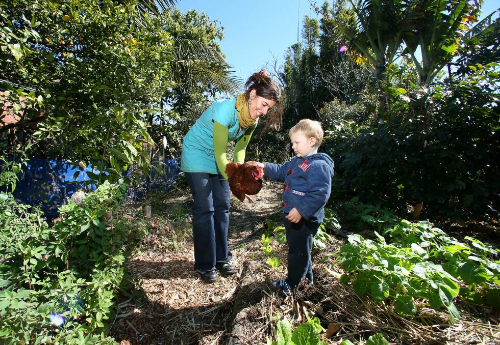Prue Keenan and Azrael Wiffen in the community garden behind North Wollongong Police Citizens Youth Club. Picture: KIRK GILMOUR