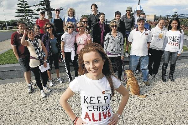 About 50 people participated in Wollongong Walking Aid on Saturday, to help Sarah Cooper (front) raise $3000 for the charity Keep a Child Alive. Picture: GREG TOTMAN