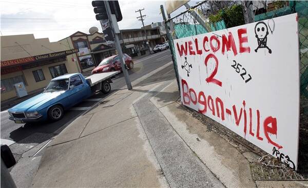 A ute passes by a sign celebrating Albion Park's bogan status Picture: ANDY ZAKELI