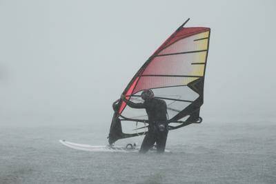 Speed sailors take to the water on Lake Illawarra as the East Coast low hits. Photo: DAVE TEASE