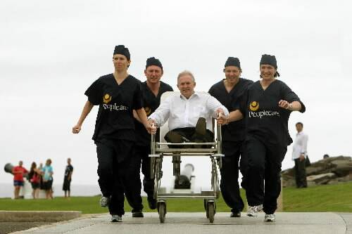 Peoplecare chief executive Michael Bassingthwaighte is taken for a ride by Kelly Baker (left), Chris Stolk, Tory Acri and Anita Mulrooney on Flagstaff Hill. Picture: SYLVIA LIBER
