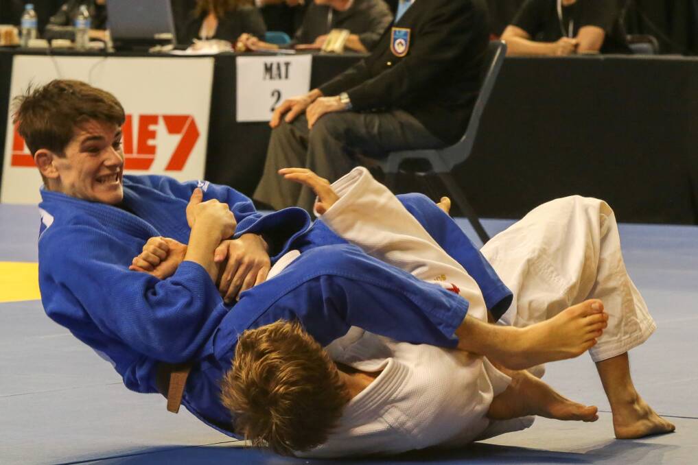 Harry Cauley (white) battles with Josh Katz in  the  Judo National Championships. Pictures: ADAM McLEAN