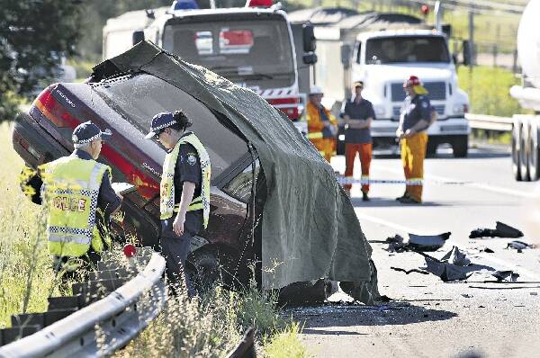 Police attend a fatal crash on Picton Rd at Wilton in January. Each fatality on the road costs $2.67 million, new data reveals.