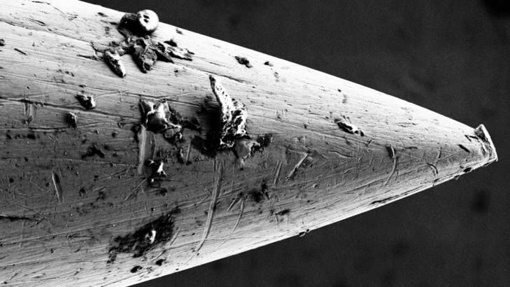 Microscopic images of needle tips before and after use. Photo: RMIT