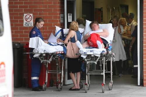 Patients spill out of Wollongong Hospital's emergency department yesterday. Picture: KEN ROBERTSON