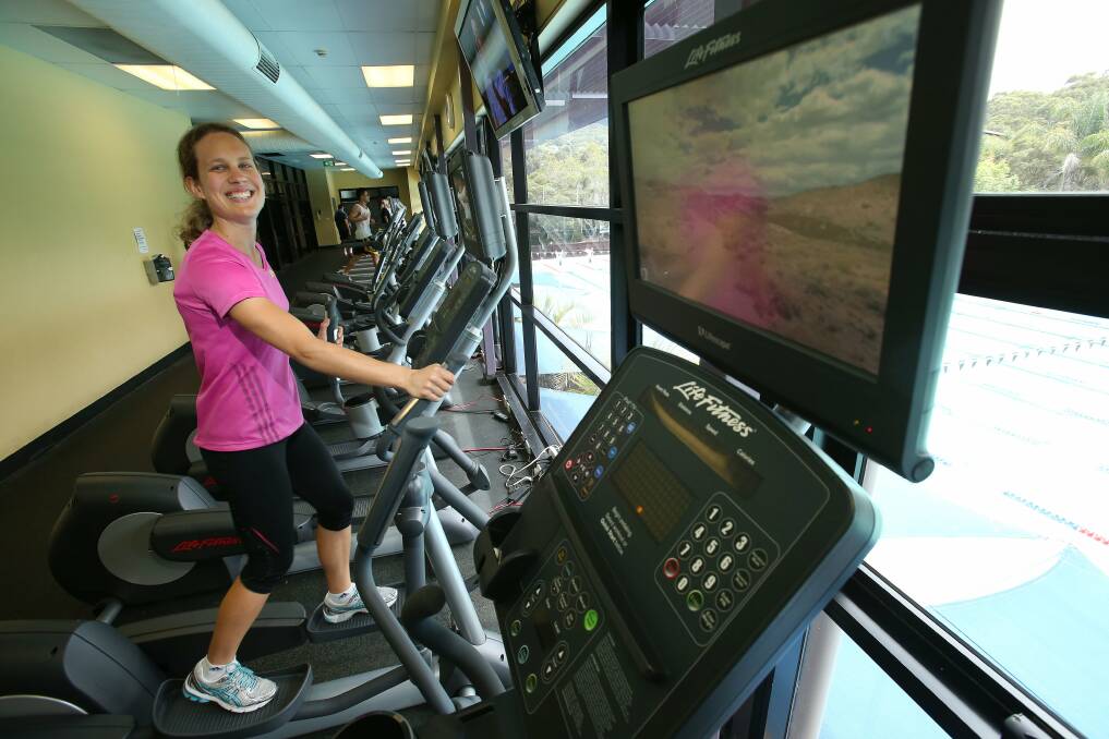 Jess Dobson on a fitness machine with a Lifescape monitor screen. Picture: KIRK GILMOUR