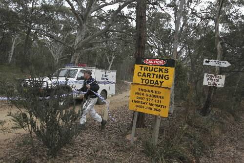 A police vehicle in Belanglo State Forest, where new remains have been found. Picture: Nick Moir