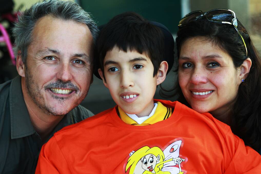Sebastian Lamas Montero, with his parents Jason and Monica Hughes.Picture: GREG TOTMAN