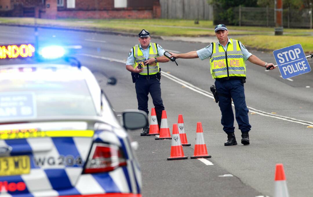 Wollongong officers Senior Constables Mark Byers and Paul McGarry on the Princes Highway at Corrimal. Picture: ORLANDO CHIODO