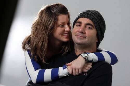 Darren Longbottom and his wife Aimee at Royal North Shore Hospital where he is making a painstaking recovery. Picture: KEN ROBERTSON