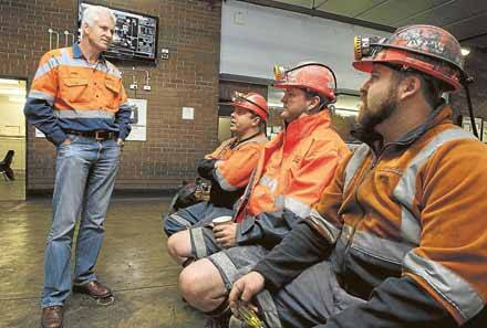 Illawarra Coal CEO Colin Bloomfield chats with West Cliff miners Daniel Grant of Buxton, Matt Smith of Russell Vale and Myles Fogarty of Windang about the Appin expansion. Picture: KEN ROBERTSON 