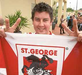 Dragons fanatic Brad Swadling of Kogarah, proudly waves the flag at the St George Leagues Club yesterday.