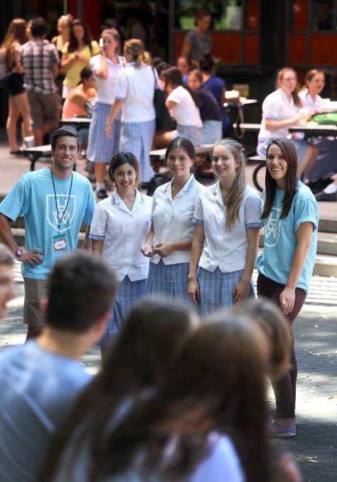  UOW Discovery Days volunteers Samuel Bailey and Evelyn Fetterplace, left and right, with year 12 students Mai Sarkissian, Izabella Mok and Julia Robinson (L-R) from St Mary Star of the Sea College Wollongong. Picture: ROBERT PEET