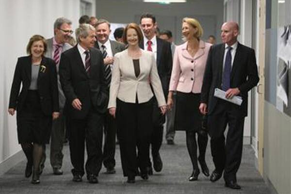 Stephen Jones (back) with Prime Minister Julia Gillard during her visit to the region last year. Picture: ROBERT PEET