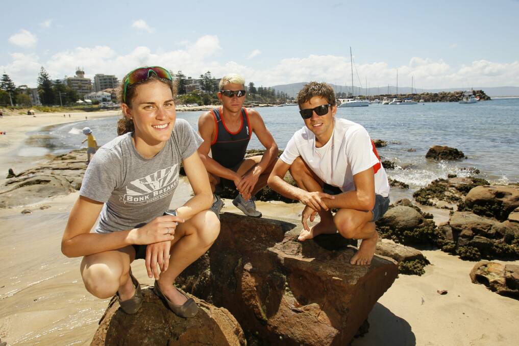 Gwen Jorgensen (left), Brendan Sexton and Aaron Royle are ready for today's Australia Day Aquathon.Picture: DAVE TEASE