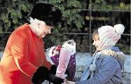 Family ties: The Queen receives flowers after attending a Christmas Day service.Picture: AP