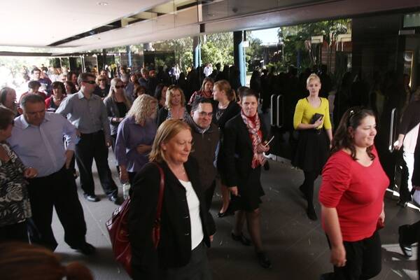 University of Wollongong staff leave a meeting yesterday after big changes were announced. Picture: ROBERT PEET