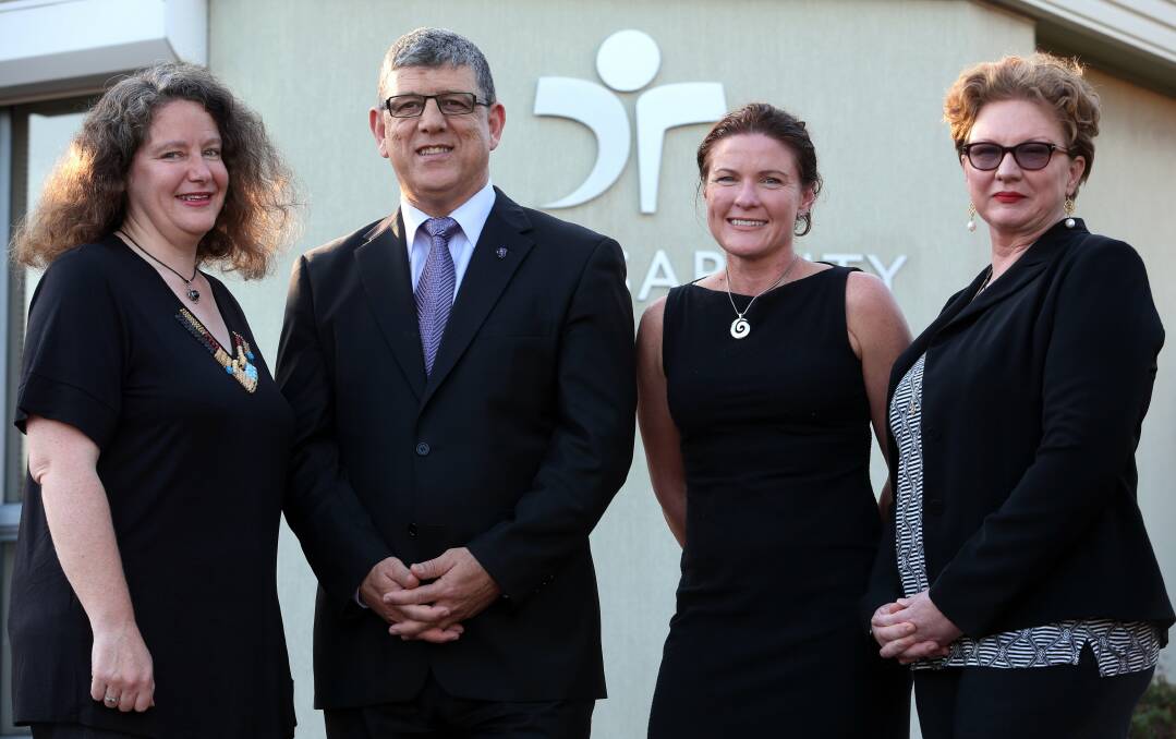  Minister for Disability Services and the Illawarra John Ajaka at yesterday's announcement with, from left, Penelope Desmazures, Pam Stiff and Anne Reeve from The Disability Trust. Picture: ROBERT PEET