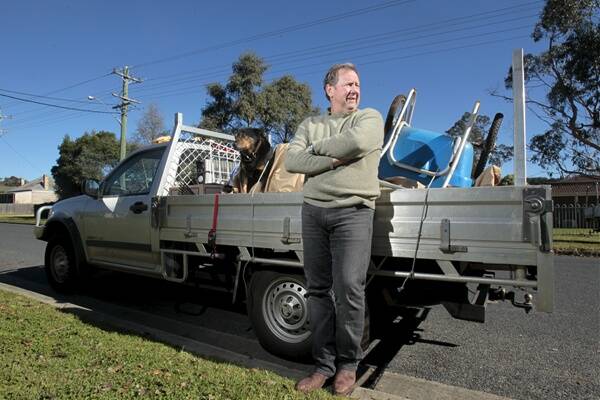 Michael Ryan and his dog Laurie. The contractor is leaving the Southern Highlands after suffering large losses in two building industry collapses. Picture: DAVE TEASE