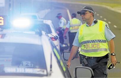 Holiday check: Lake Illawarra highway patrol officers conduct breath tests at Shell Cove yesterday as part of Operation Safe Arrival.Picture: GREG TOTMAN
